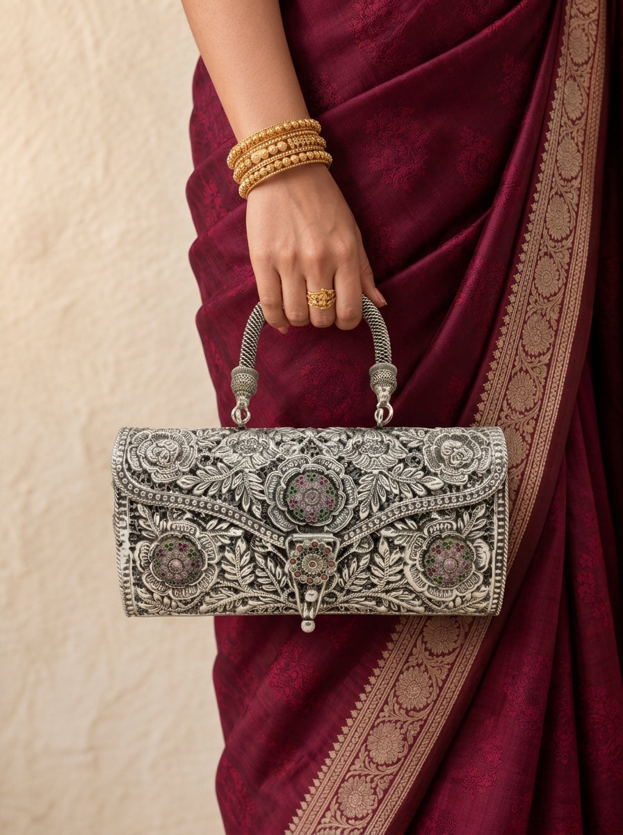 Gulmohar Silver Handbag - Hand Holding with Saree