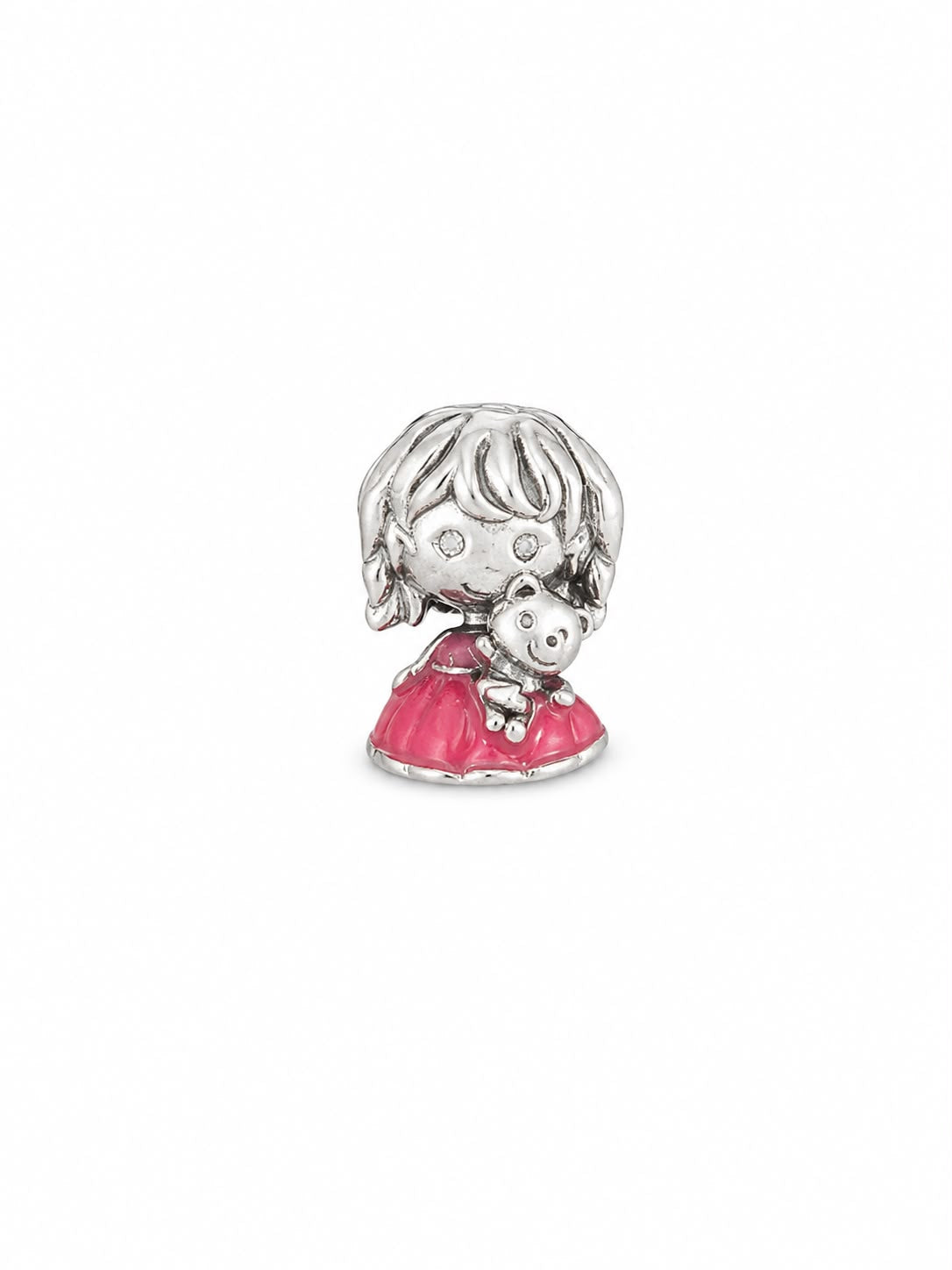 A silver-toned charm featuring a cute cartoon girl with short hair holding a teddy bear, wearing a bright pink dress, on a plain white background.